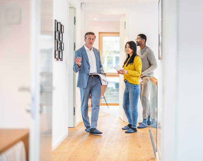 Couple house hunting with real estate agent