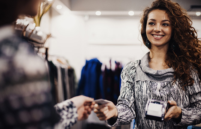 Woman using credit/debit card